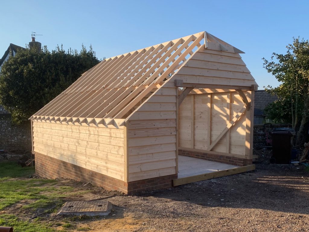 Oak-framed garden room under construction