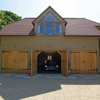 Large oak garage with doors open